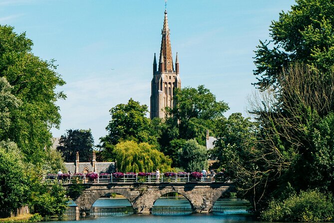 2-Hour Historical Walking Tour in Bruges with Praline Included - Canal views, beer, and Bruges’ darker corners