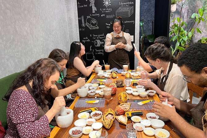 Bean to bar Chocolate Workshop in Ho Chi Minh City - Husking beans and grinding cacao paste