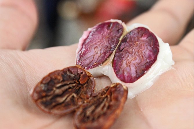A ripe cacao pod cut open to show the beans in their white pulp