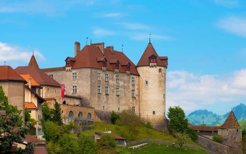 From Lausanne: Gruyères Tour with Train, Chocolate & Cheese - Seeing Gruyère cheese being made