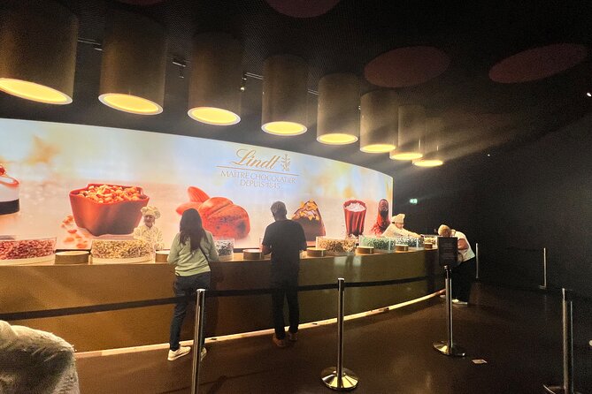 Lindt Home of Chocolate Museum Entry Ticket with Pickup - Entering beneath the 9-meter chocolate fountain