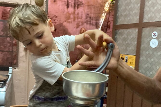 Make Your Own Chocolate with Oaxacan Tradition Private Class - Peeling the beans and hearing the local story