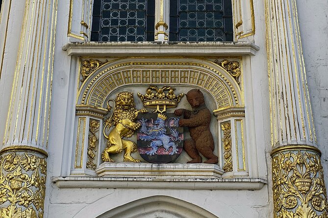 Secrets of Bruges: Walking Tour With a Chocolate and Waffle Bite - Burg Square, blood, and Renaissance Bruges