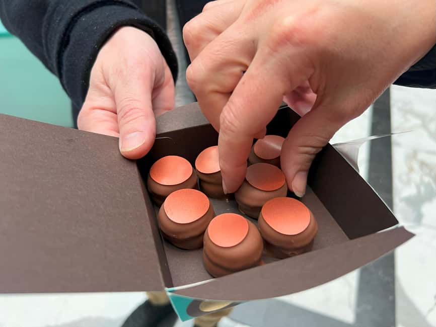 Zurich: Food Tour of 8+ Tastings with Cheeses & Chocolates - Zurich Old Town with a plate in hand