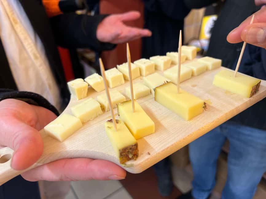 Zurich: Food Tour of 8+ Tastings with Cheeses & Chocolates - The cheese shop, hay schnaps, and Chäschüechli